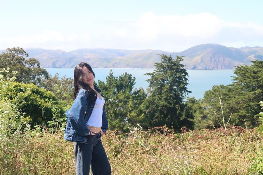 Mandy on a hillside above the bay