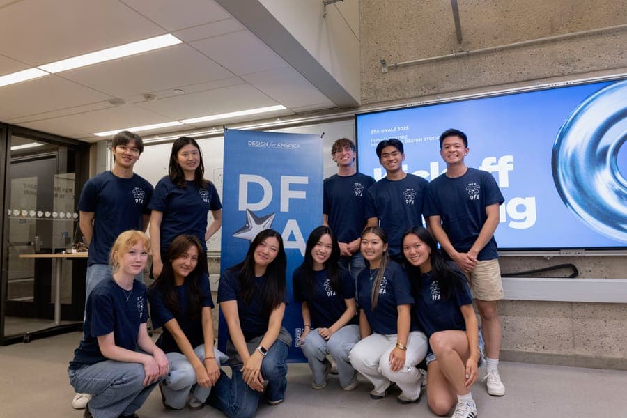 The DFA Yale board in matching shirts